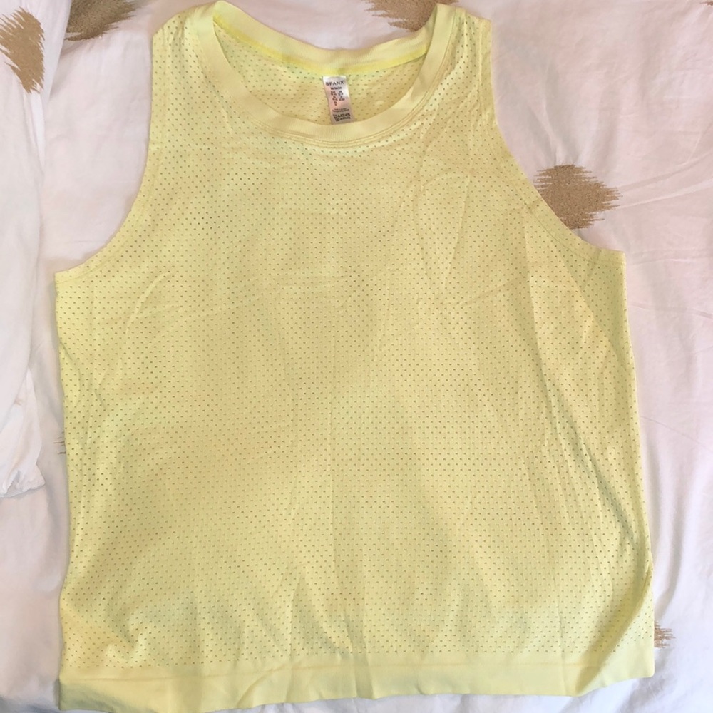 Bright yellow lightweight workout top. Breathable fabric.